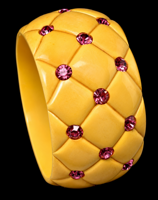 wide quilt carved soft yellow bakelite bangle with pink rhinestones